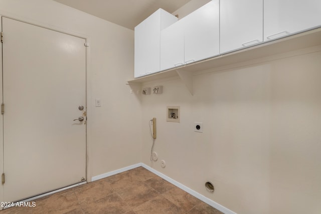 laundry room with cabinets, washer hookup, hookup for a gas dryer, and hookup for an electric dryer