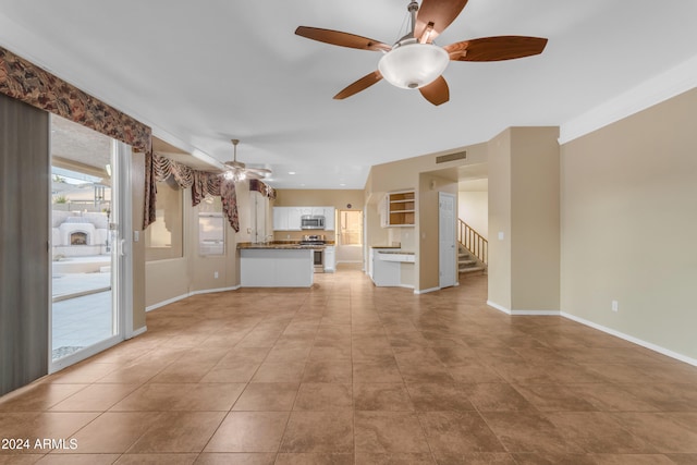 unfurnished living room with light tile patterned floors