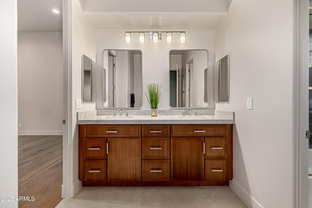 bathroom featuring vanity and hardwood / wood-style floors