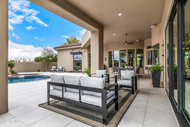 view of patio with ceiling fan, outdoor lounge area, and a fenced in pool