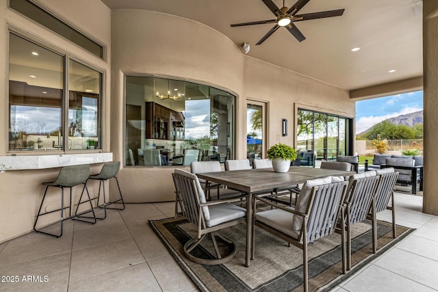 view of patio / terrace featuring ceiling fan, outdoor lounge area, and an outdoor bar