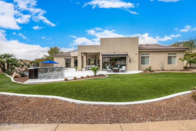 rear view of house with an outdoor living space, a yard, and a patio area