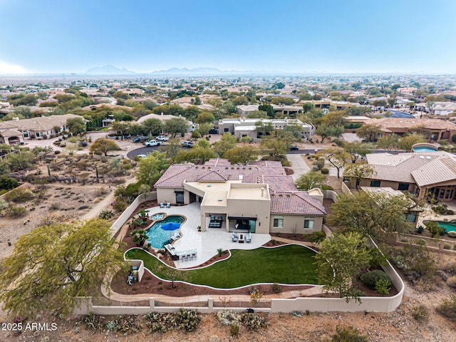 birds eye view of property featuring a mountain view