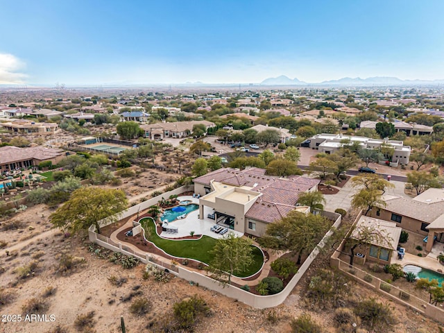 birds eye view of property with a mountain view