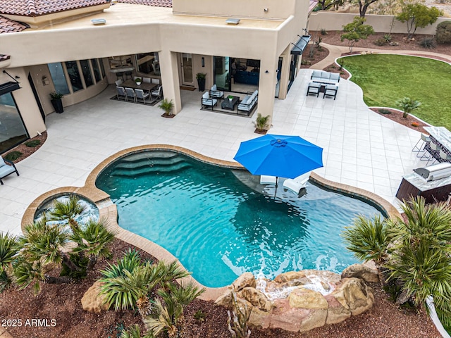 view of pool with an outdoor hangout area and a patio area