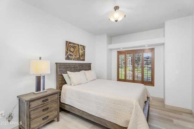 bedroom with light wood-type flooring