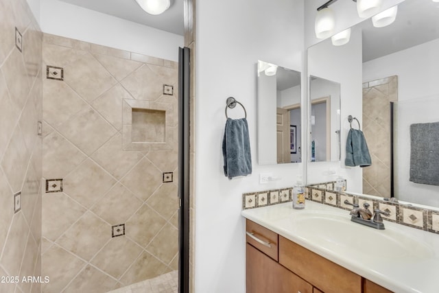 full bathroom featuring vanity and a stall shower