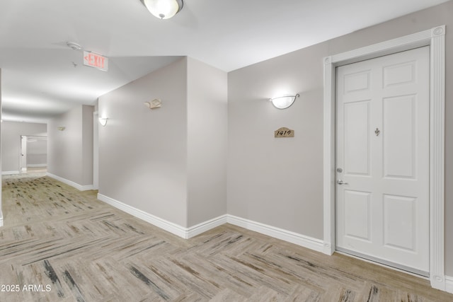 interior space featuring baseboards