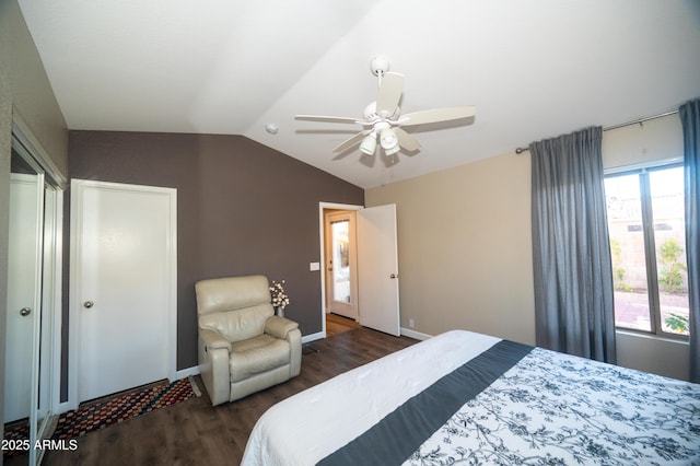 bedroom with lofted ceiling, dark hardwood / wood-style floors, and ceiling fan