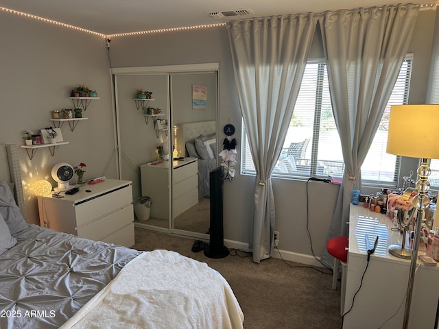 carpeted bedroom featuring a closet