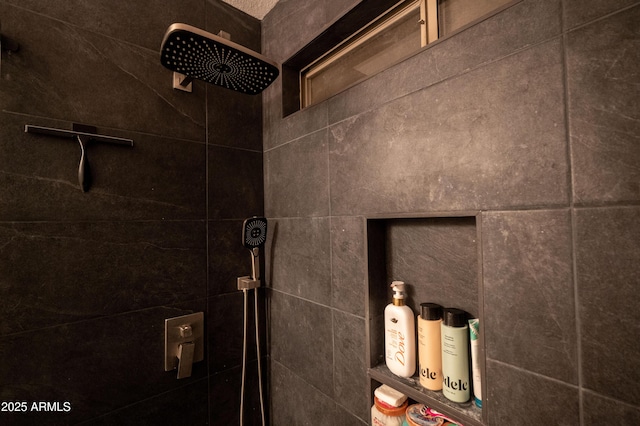 interior details featuring tiled shower