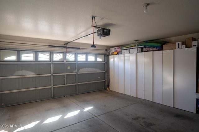 garage featuring a garage door opener