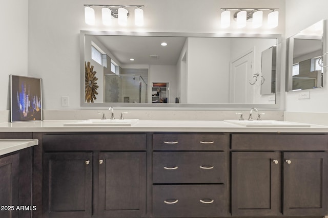 13204 W Via Dona Rd, Peoria, AZ 85383 - full bathroom featuring double vanity, a sink, and a stall shower
