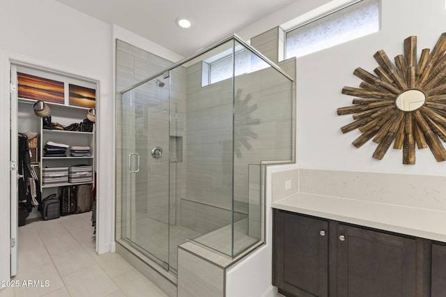 13204 W Via Dona Rd, Peoria, AZ 85383 - full bath with a spacious closet, recessed lighting, a stall shower, and tile patterned floors