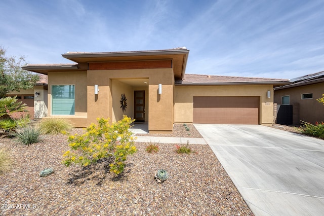 13204 W Via Dona Rd, Peoria, AZ 85383 - prairie-style house with driveway, stucco siding, and an attached garage