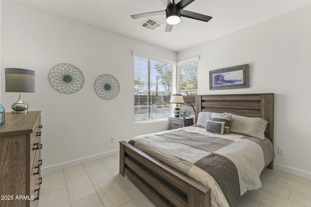 13204 W Via Dona Rd, Peoria, AZ 85383 - bedroom with light tile patterned floors, baseboards, ceiling fan, and visible vents