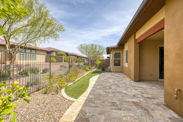 13204 W Via Dona Rd, Peoria, AZ 85383 - view of yard with a fenced backyard and a patio area
