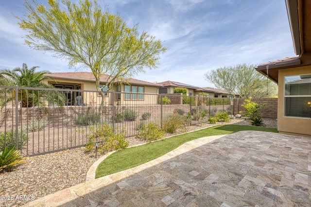 13204 W Via Dona Rd, Peoria, AZ 85383 - view of yard featuring a fenced backyard and a patio area