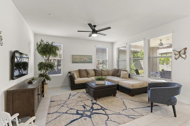 13204 W Via Dona Rd, Peoria, AZ 85383 - living area featuring a ceiling fan, light tile patterned floors, baseboards, and a wealth of natural light