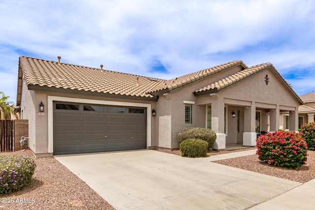 18614 E Oriole Way, Queen Creek, AZ 85142 - mediterranean / spanish house featuring stucco siding, a garage, concrete driveway, and a tiled roof