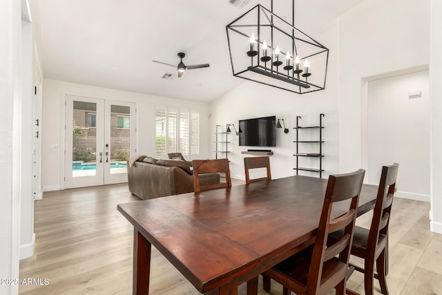 18614 E Oriole Way, Queen Creek, AZ 85142 - dining area featuring french doors, light wood finished floors, lofted ceiling, a ceiling fan, and baseboards