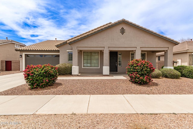 18614 E Oriole Way, Queen Creek, AZ 85142 - view of front of property featuring an attached garage, stucco siding, covered porch, and a tiled roof