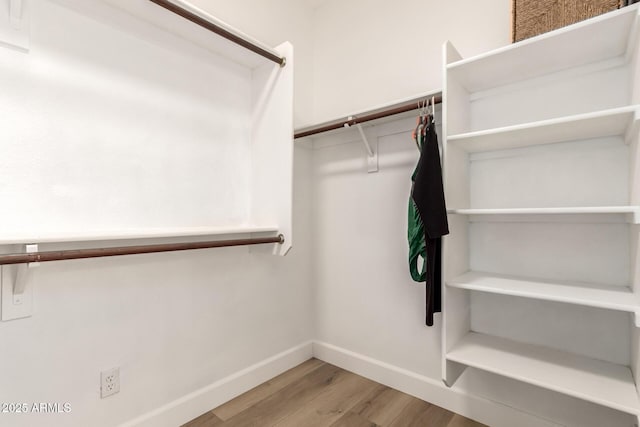 18614 E Oriole Way, Queen Creek, AZ 85142 - walk in closet featuring light wood-style floors