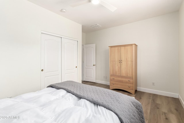 18614 E Oriole Way, Queen Creek, AZ 85142 - bedroom with a closet, wood finished floors, baseboards, and ceiling fan