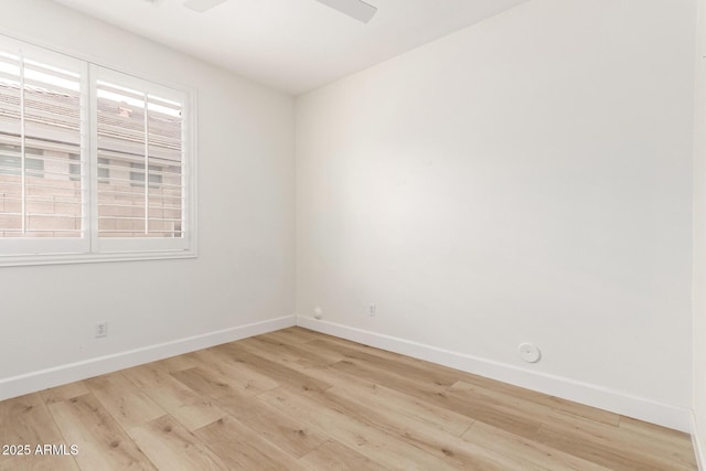 18614 E Oriole Way, Queen Creek, AZ 85142 - empty room featuring light wood-style flooring, baseboards, and a ceiling fan