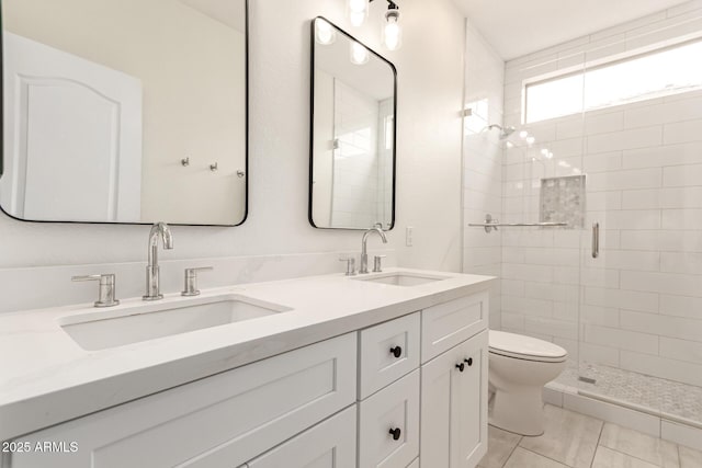 18614 E Oriole Way, Queen Creek, AZ 85142 - bathroom featuring toilet, a shower stall, double vanity, and tile patterned floors