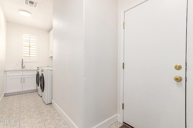 18614 E Oriole Way, Queen Creek, AZ 85142 - laundry room with cabinet space, washer and clothes dryer, and baseboards