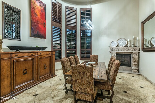 kitchen with built in features, sink, light stone counters, a kitchen island with sink, and dishwasher