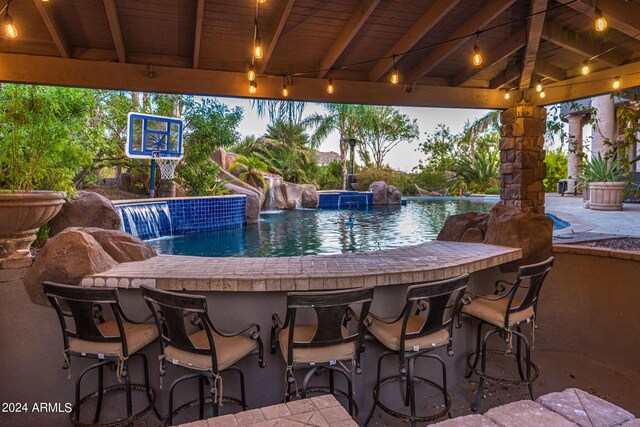 view of patio with an outdoor living space with a fire pit and ceiling fan