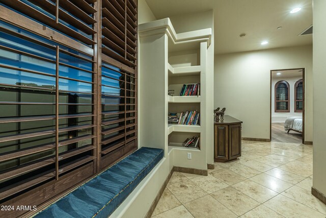 full bathroom featuring tile patterned flooring, shower / bathtub combination with curtain, toilet, and vanity