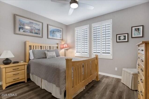 15221 N Clubgate Dr Unit 2096, Scottsdale, AZ 85254 - bedroom with dark wood-style floors and a ceiling fan