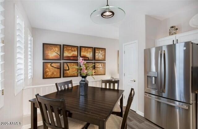 15221 N Clubgate Dr Unit 2096, Scottsdale, AZ 85254 - dining room featuring dark wood-style flooring and baseboards