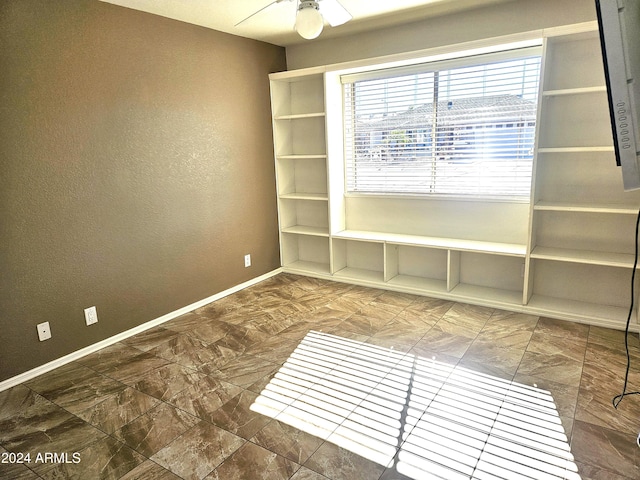 spare room featuring ceiling fan