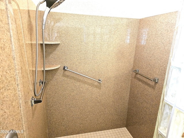 bathroom featuring tile patterned floors and tiled shower