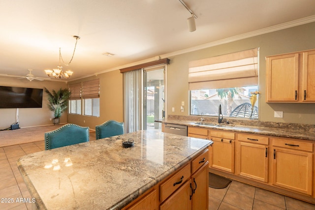 11526 W Bermuda Dr, Avondale, AZ 85392 - kitchen featuring a sink, light tile patterned flooring, open floor plan, stainless steel dishwasher, and ornamental molding
