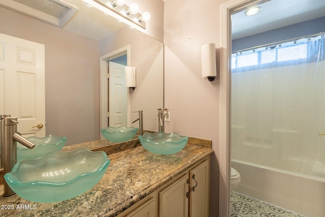 11526 W Bermuda Dr, Avondale, AZ 85392 - bathroom featuring vanity, toilet, and shower / bath combo with shower curtain