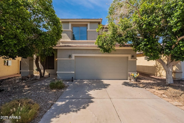 11526 W Bermuda Dr, Avondale, AZ 85392 - view of front facade featuring driveway, stucco siding, and an attached garage