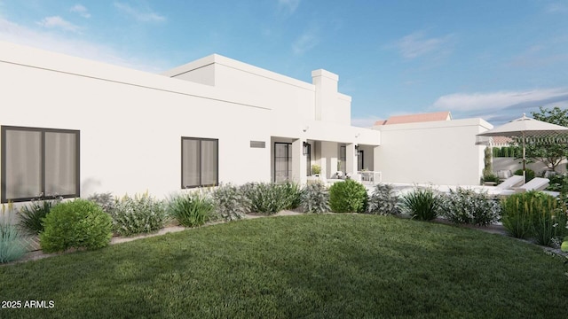 rear view of property with a yard and stucco siding