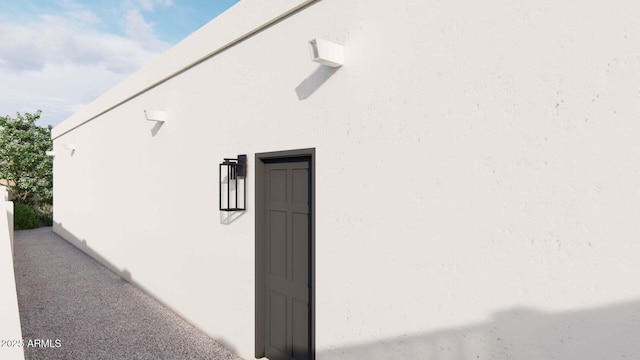 view of side of home featuring stucco siding