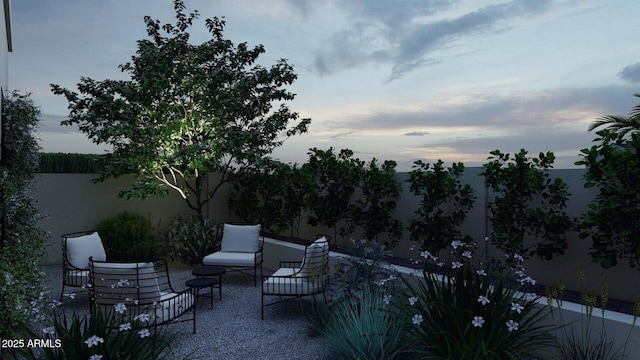 view of patio featuring fence