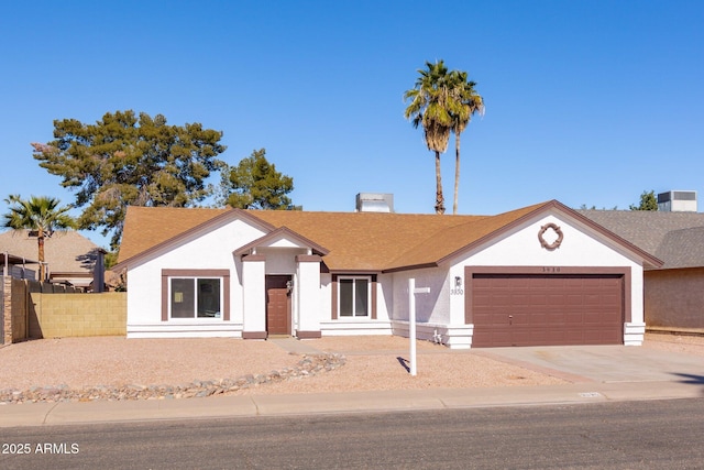 ranch-style house featuring a garage