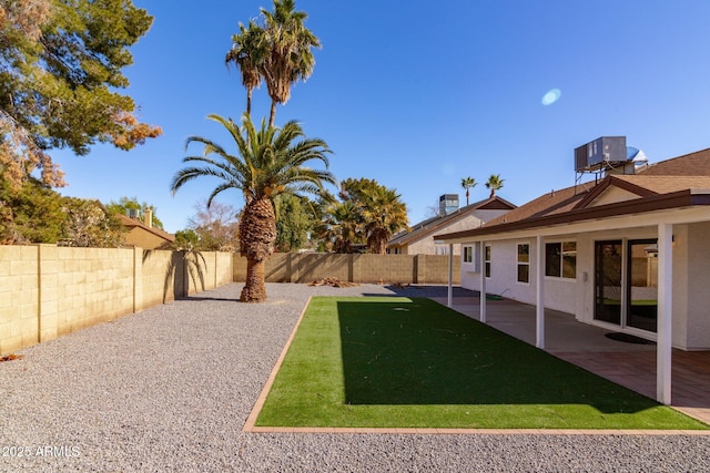 view of yard featuring a patio area and central AC unit