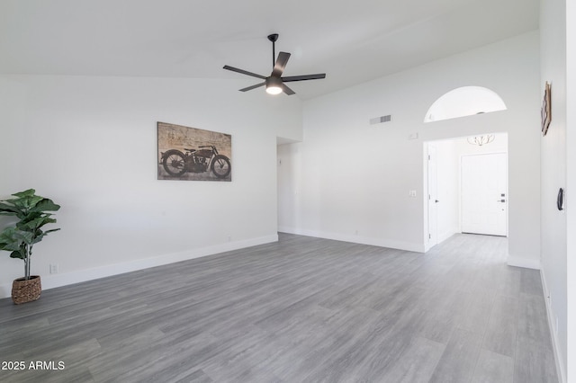 unfurnished room featuring ceiling fan, hardwood / wood-style flooring, and high vaulted ceiling