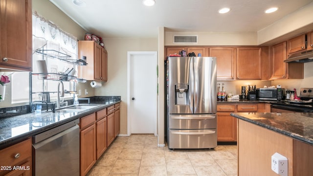 7274 W State Ave, Glendale, AZ 85303 - kitchen with stainless steel appliances, under cabinet range hood, brown cabinetry, and recessed lighting