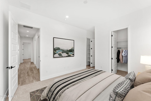 13947 E Barwick Dr, Scottsdale, AZ 85262 - carpeted bedroom featuring baseboards, recessed lighting, visible vents, and a walk in closet