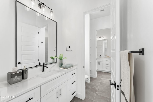 13947 E Barwick Dr, Scottsdale, AZ 85262 - bathroom featuring tile patterned floors, visible vents, toilet, and vanity